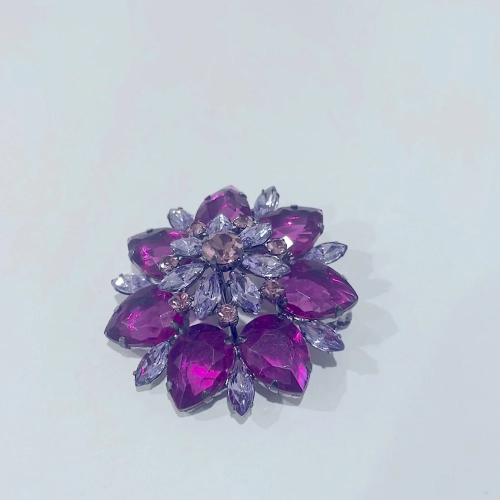 Pretty costume flower pin in pinks and purples. New.